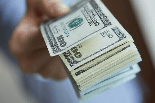 Bundle of $100 bills symbolizing child support payment in TN
